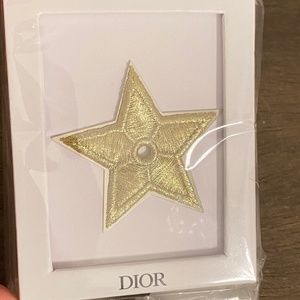 New unopened Dior gold tone star patch in box